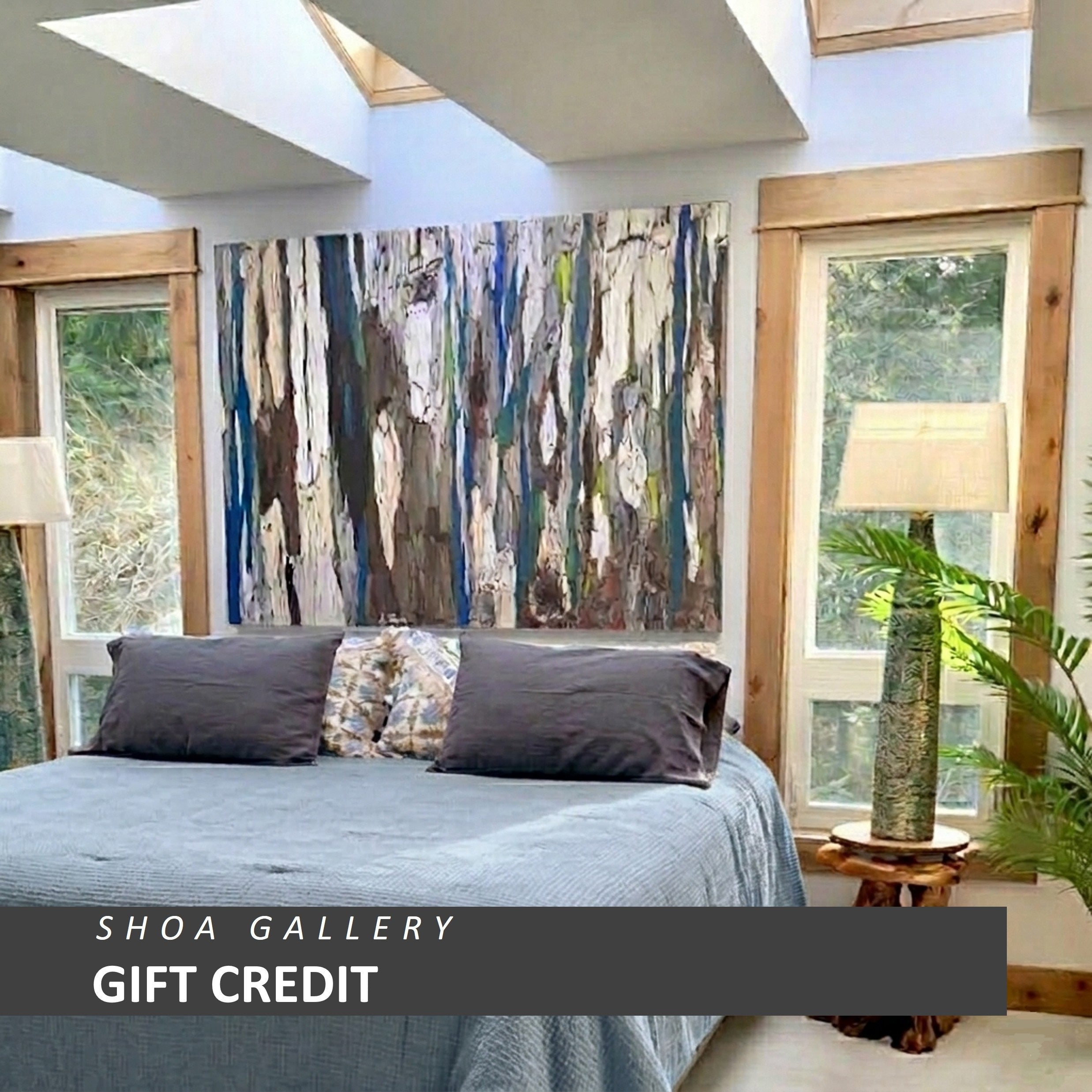 Shoa Gallery gift card displayed in a modern living room with framed artwork