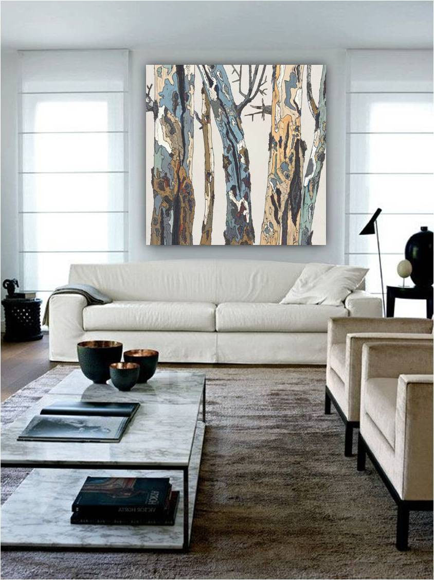 Oversized canvas print of tree artwork in an all-white contemporary living room above the sofa between 2 windows