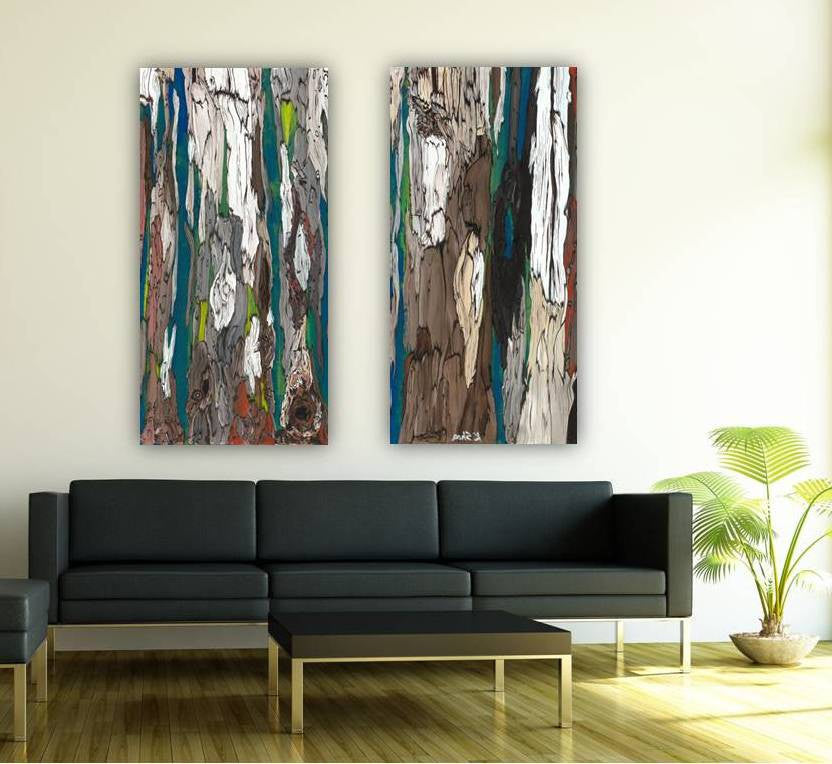 A set of two abstract diptych canvas art prints featuring trees in blue, brown, and white colors, displayed above a black sofa in a contemporary living room.