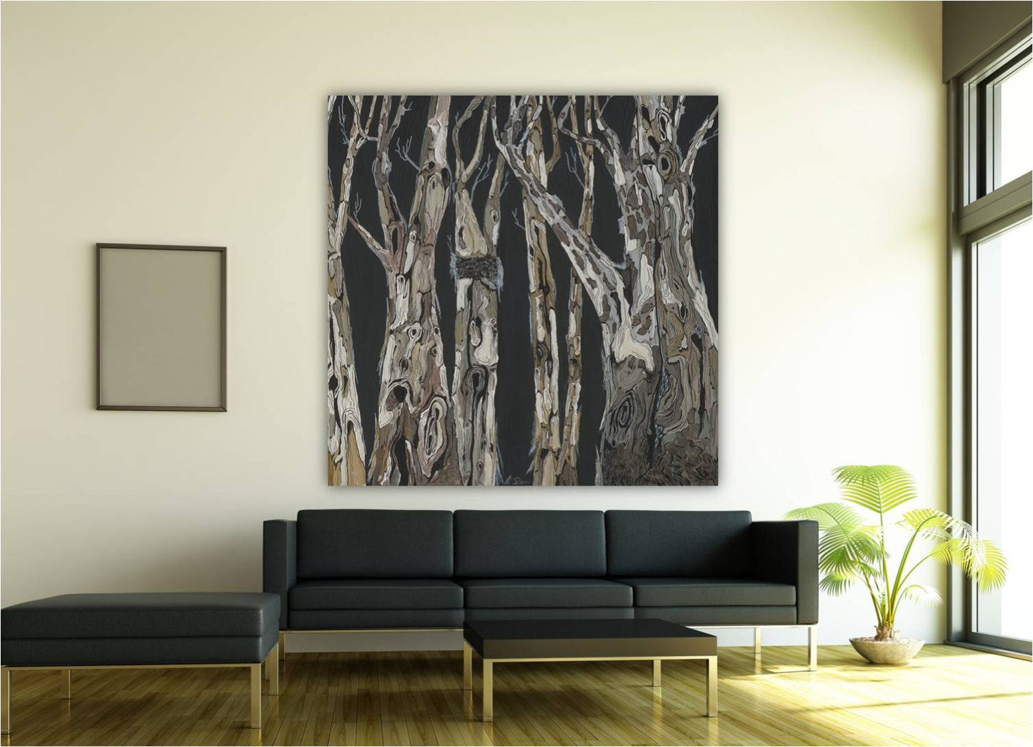 Extra large masculine wall art of trees; dark background, gray, white, brown tree trunks on very large wall above a MCM sofa