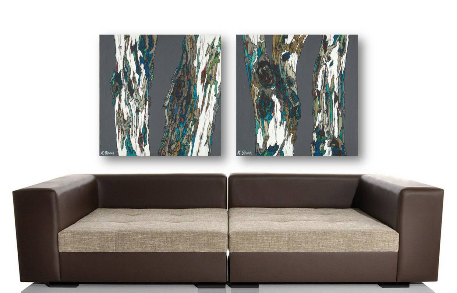 Oversized masculine diptych of 2 canvas tree art panels above a large MCM mid-century modern sofa