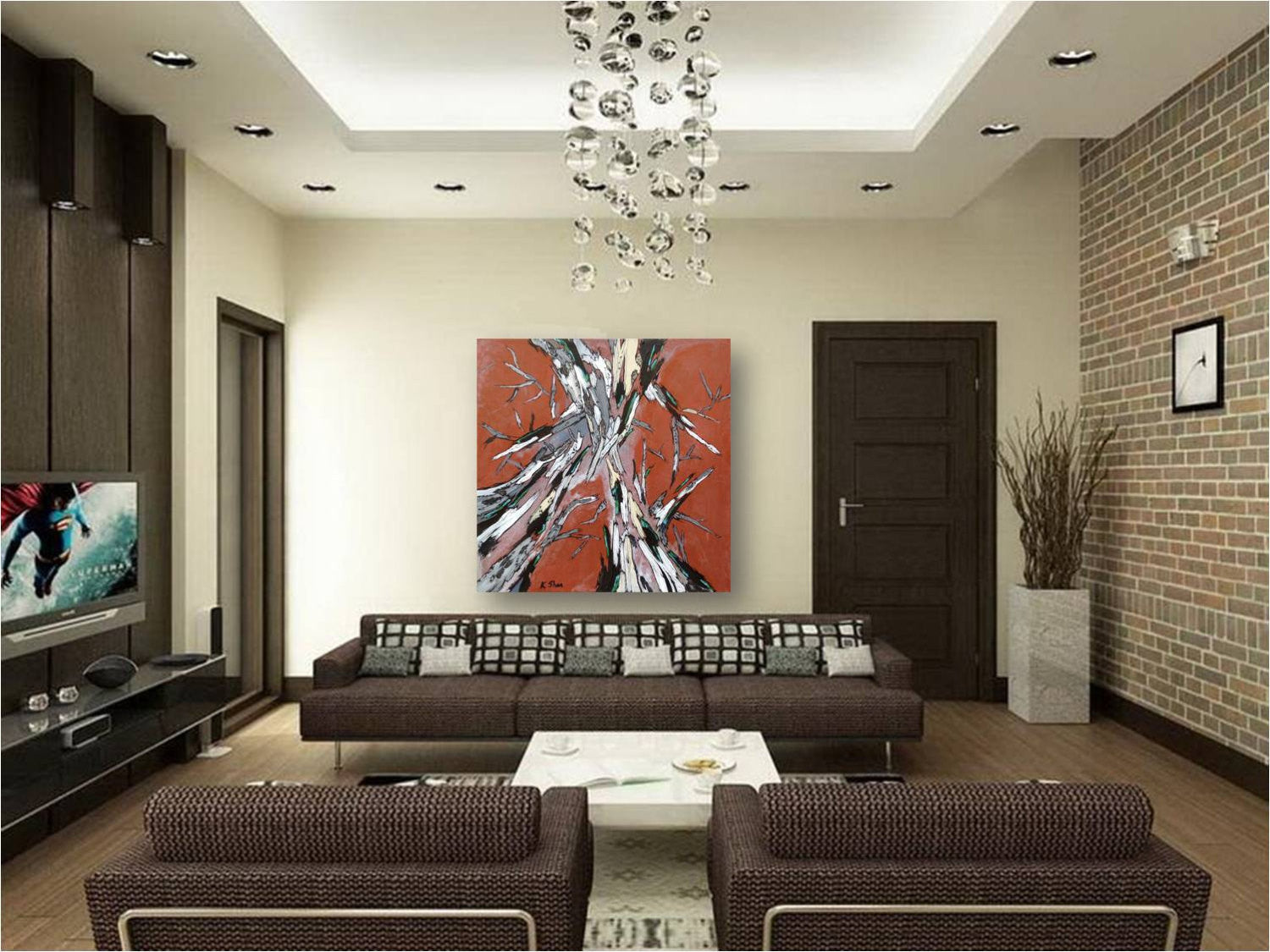 Ovresized canvas art print of abstract tree canopy on large blank wall of MCM modern living room