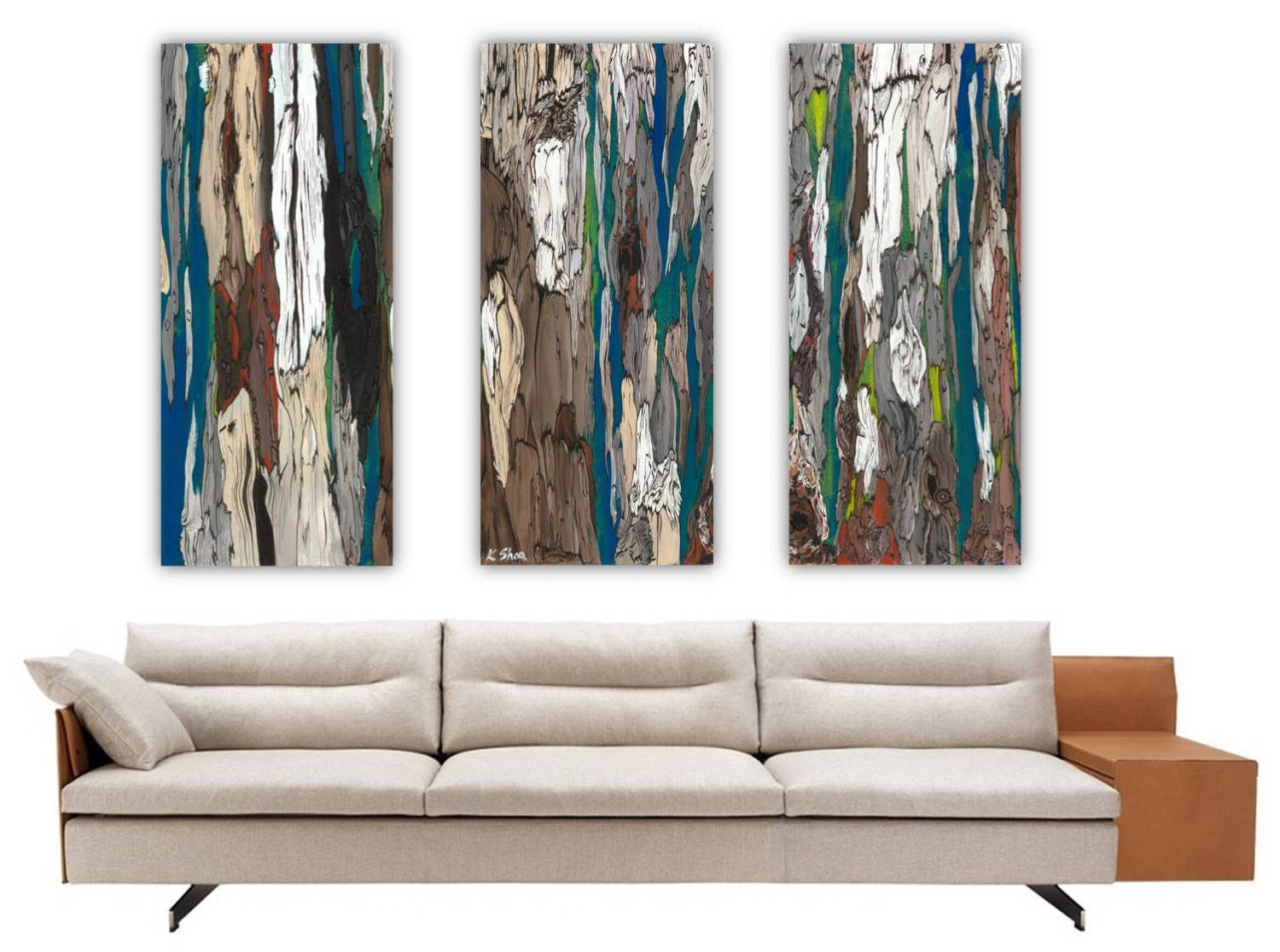 Oversized triptych canvas print of abstract painting. Over a huge white sofa in a modern living room or hotel lobby