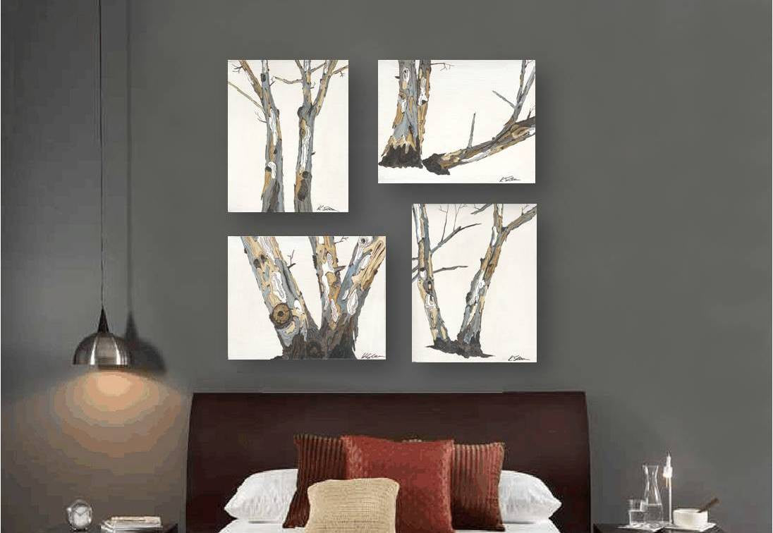 Gallery display of 4 minimalist tree artworks in light and airy colors in a bold and moody bedroom