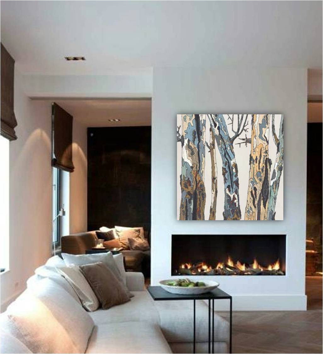 Oversized square canvas art print of trees in pastel colors on a large wall above a clean-face fireplace