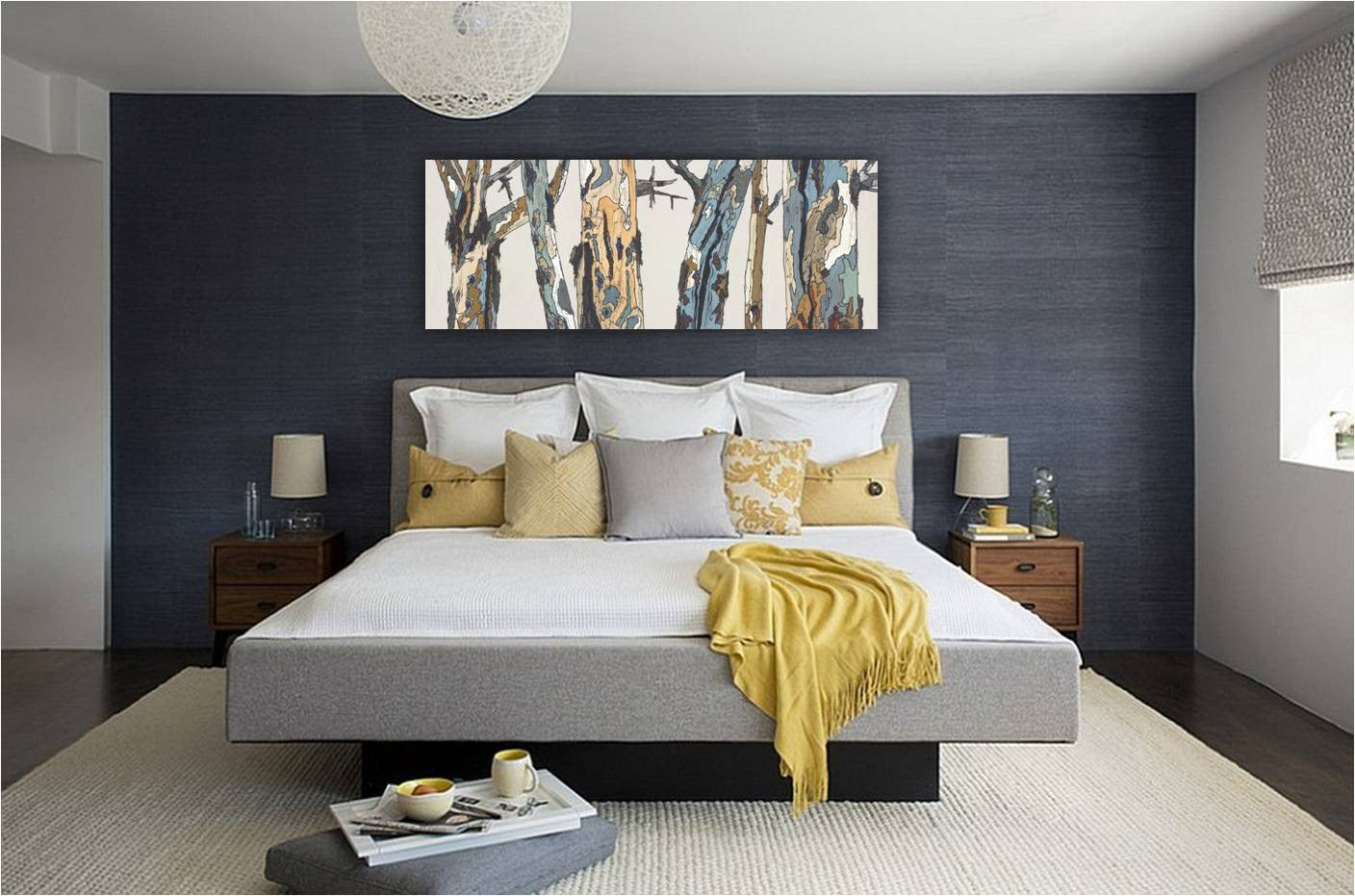 Extra Wide Canvas Wall Art of Trees in light colors on a dark wall of modern bedroom