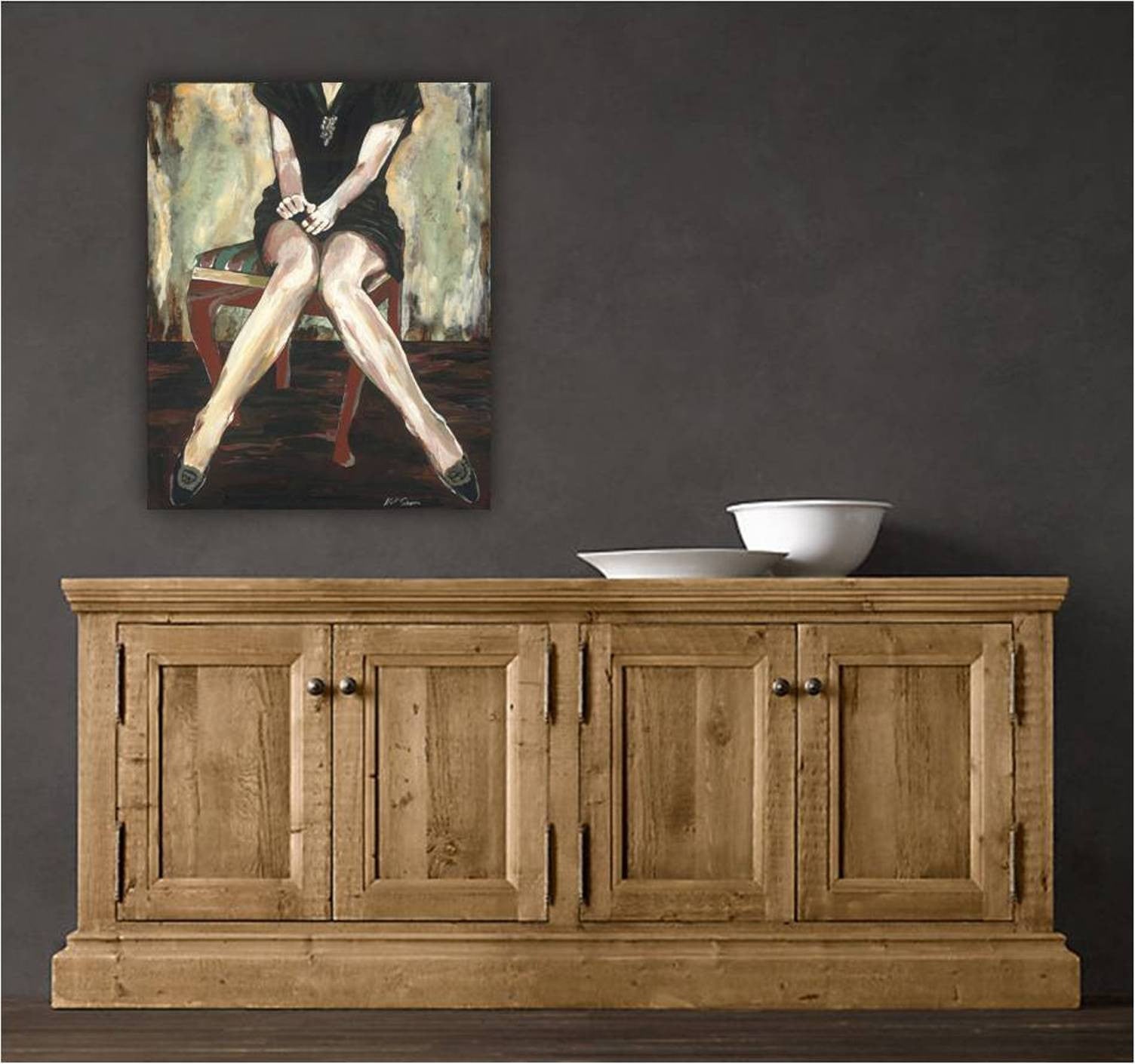 Canvas print of a sensual woman hung over a rustic furniture in a dining room or entryway.