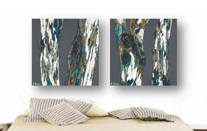 Two oversized diptych wall art panels of  modern tree trunks in gray, blue, white, and green, in a masculine bedroom.