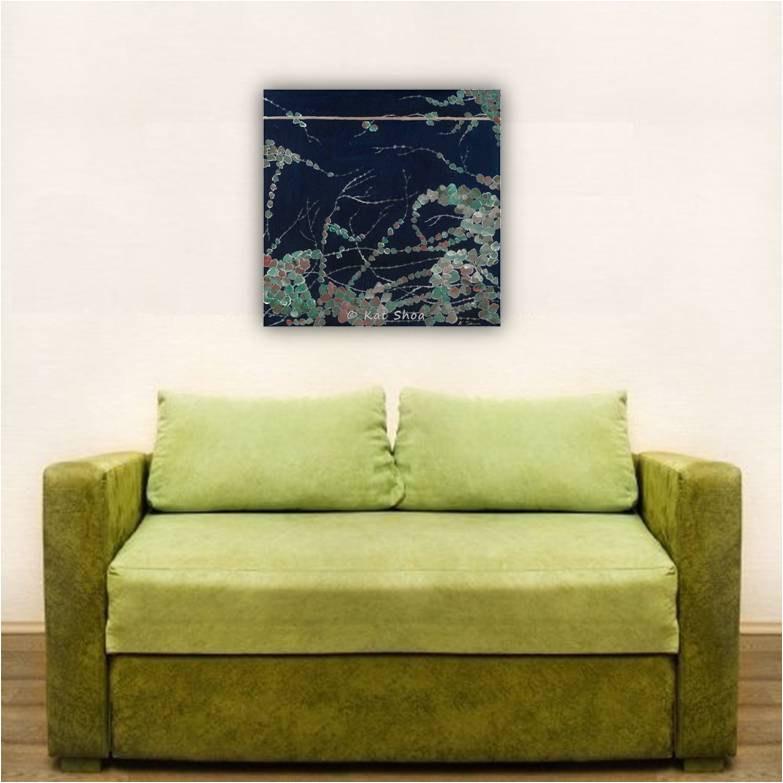 Dark blue artwork canvas print - cute and feminine - over a plush green loveseat