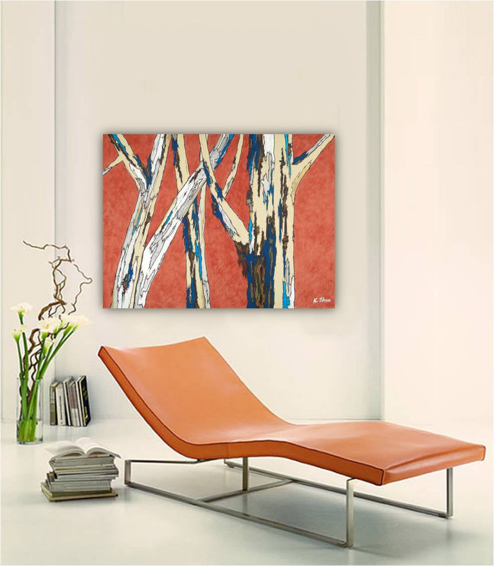 An large canvas print of a modern landscape with orange and blue birch trees, above a contemporary sofa in a minimalist living room setting.