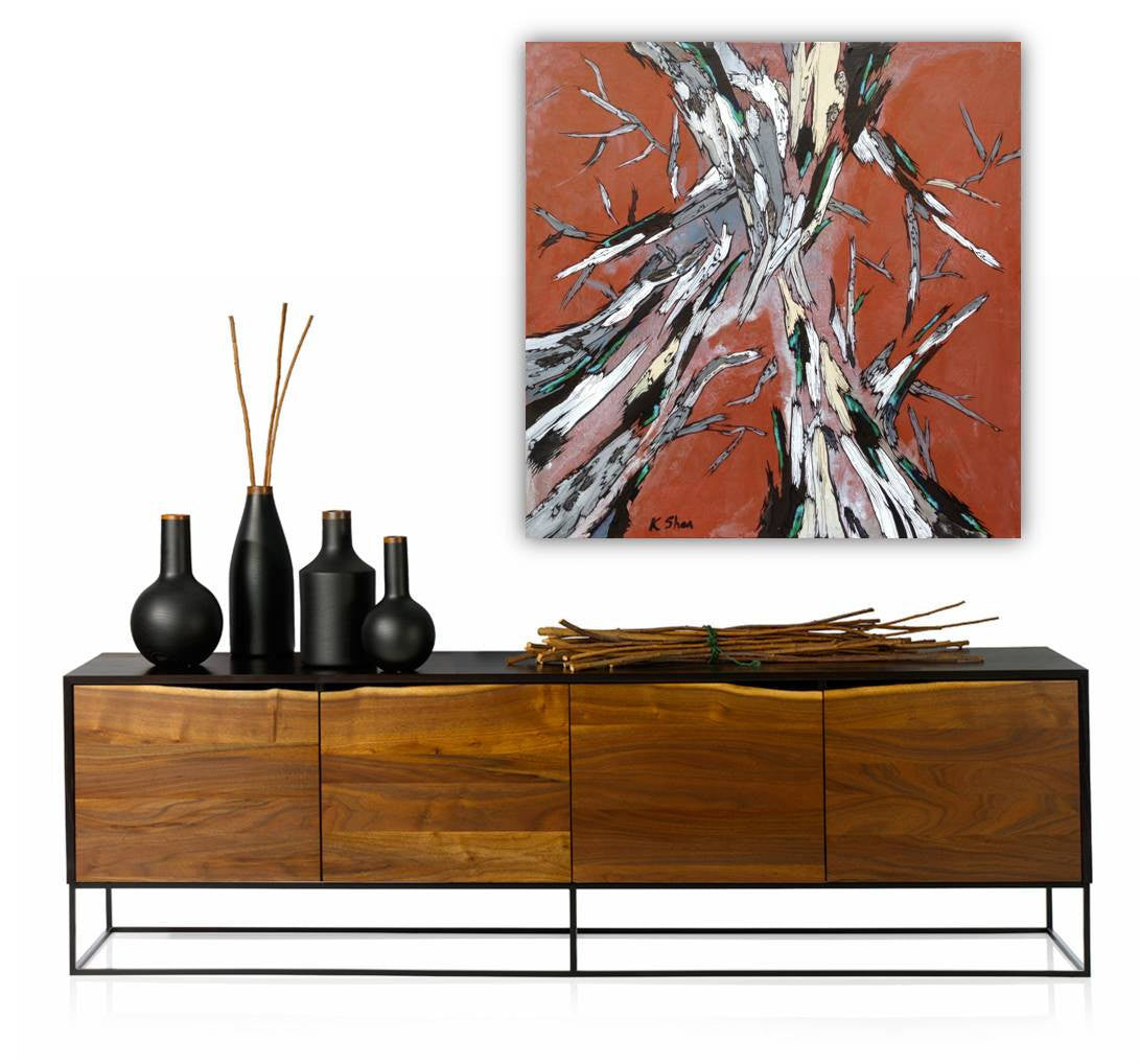 Large abstract tree art canvas with brick orange background. Hung on a blank wall in entryway or office