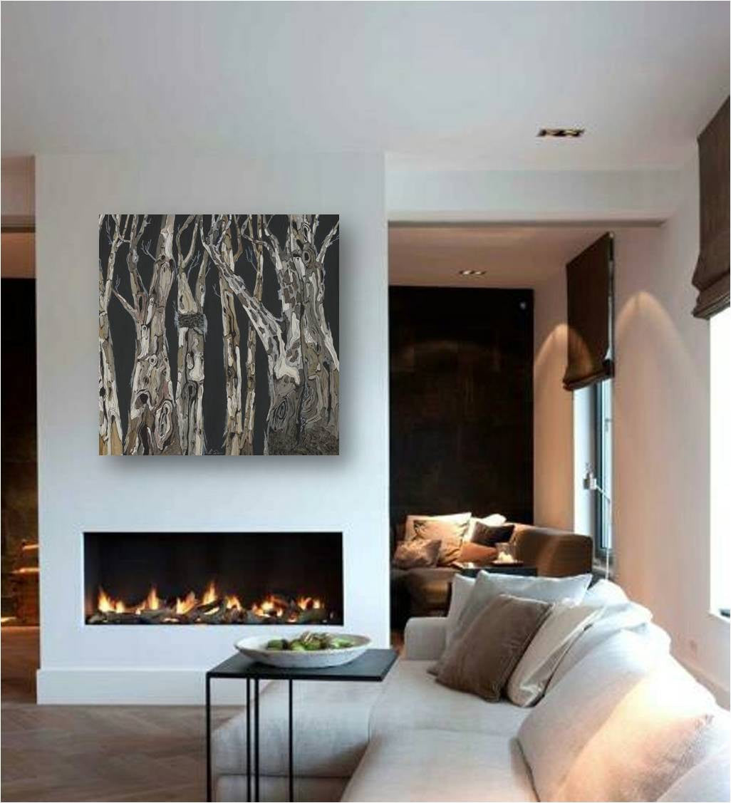Large bold landscape canvas art print of trees above a clean-face fireplace in a contemporary open living space
