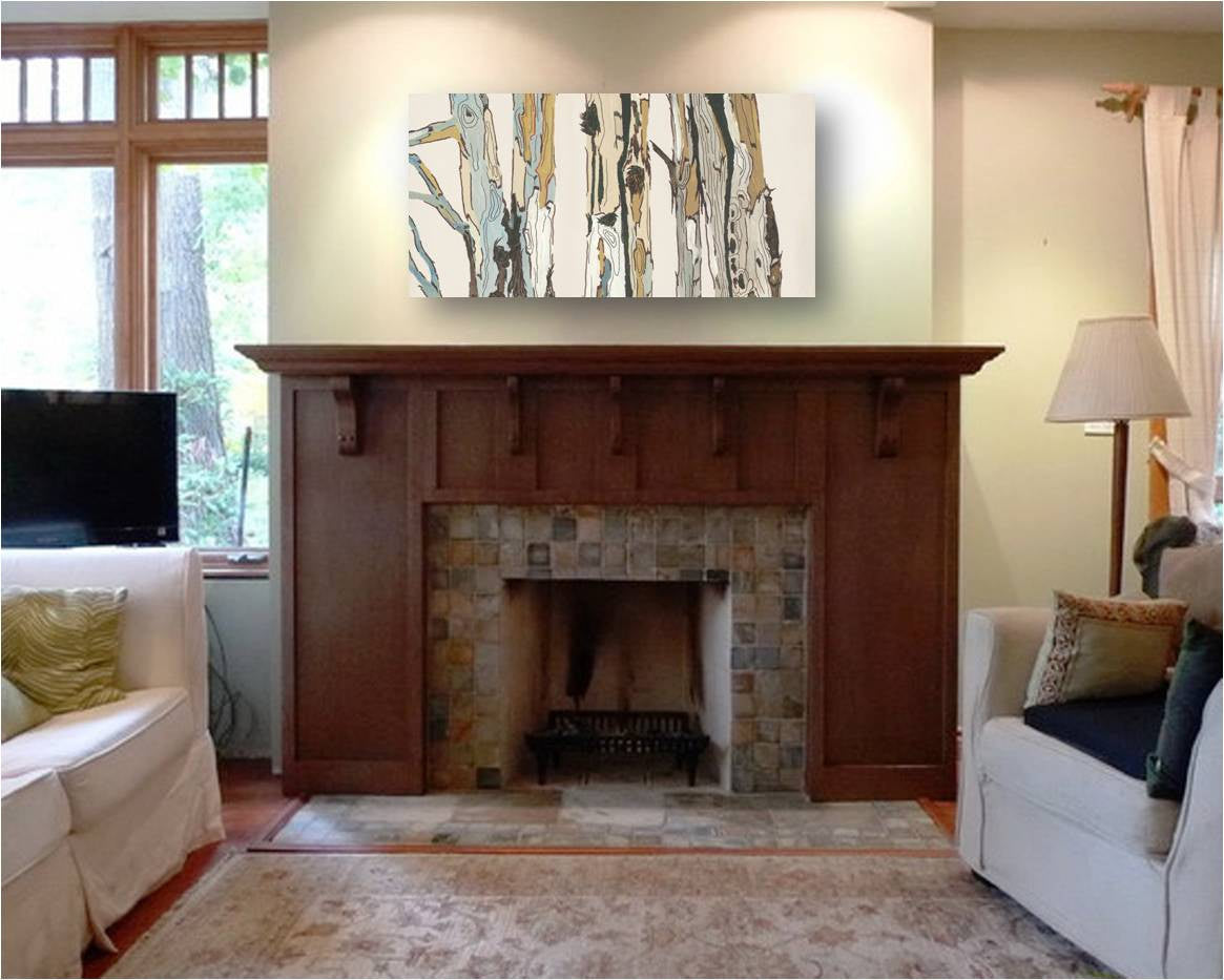 Horizontal canvas art print of trees above a wood fireplace mantel in small living room