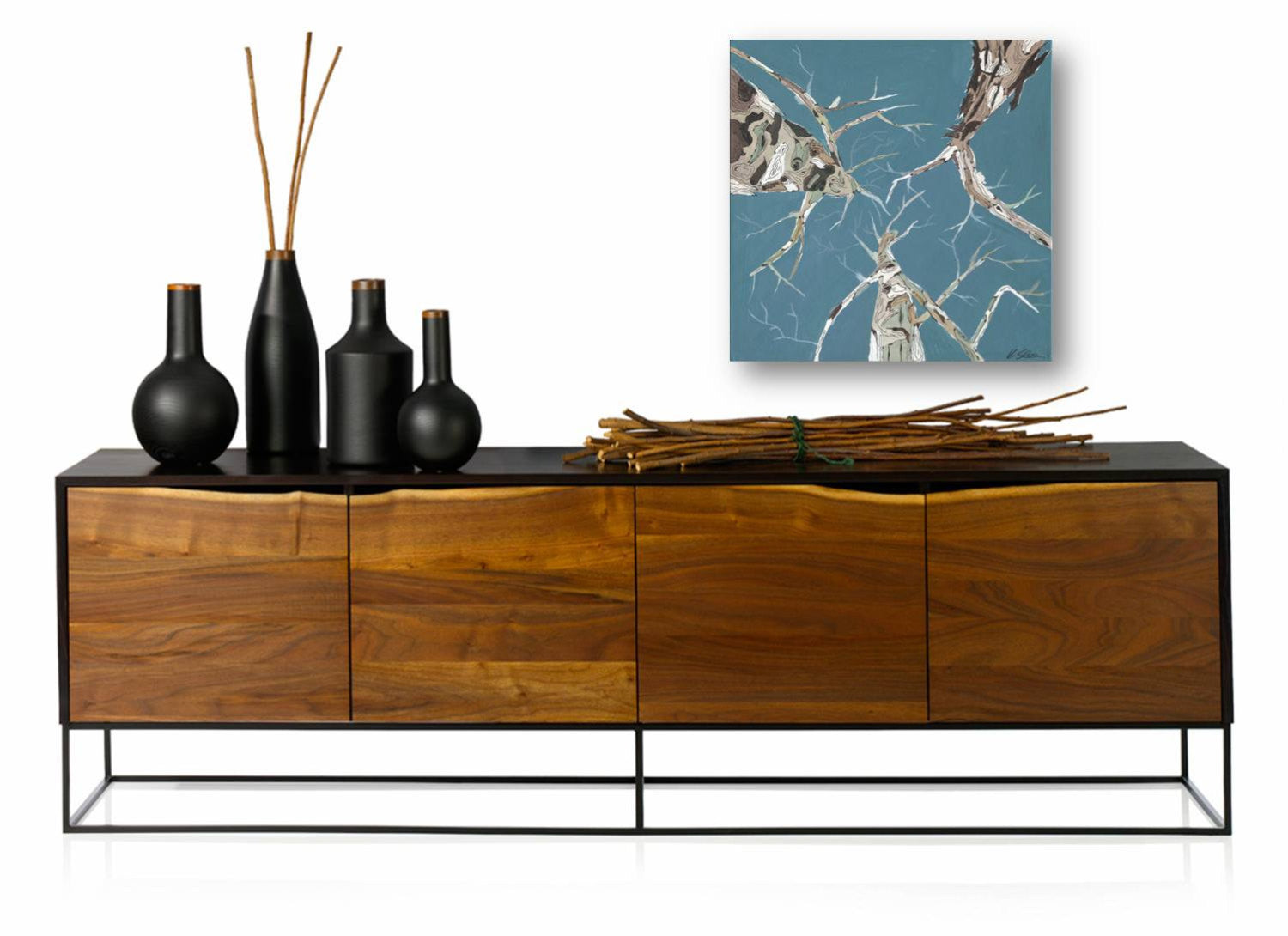 Very pretty and airy painting of trees against blue sky - hung above a rustic modern cabinet in a living room or office