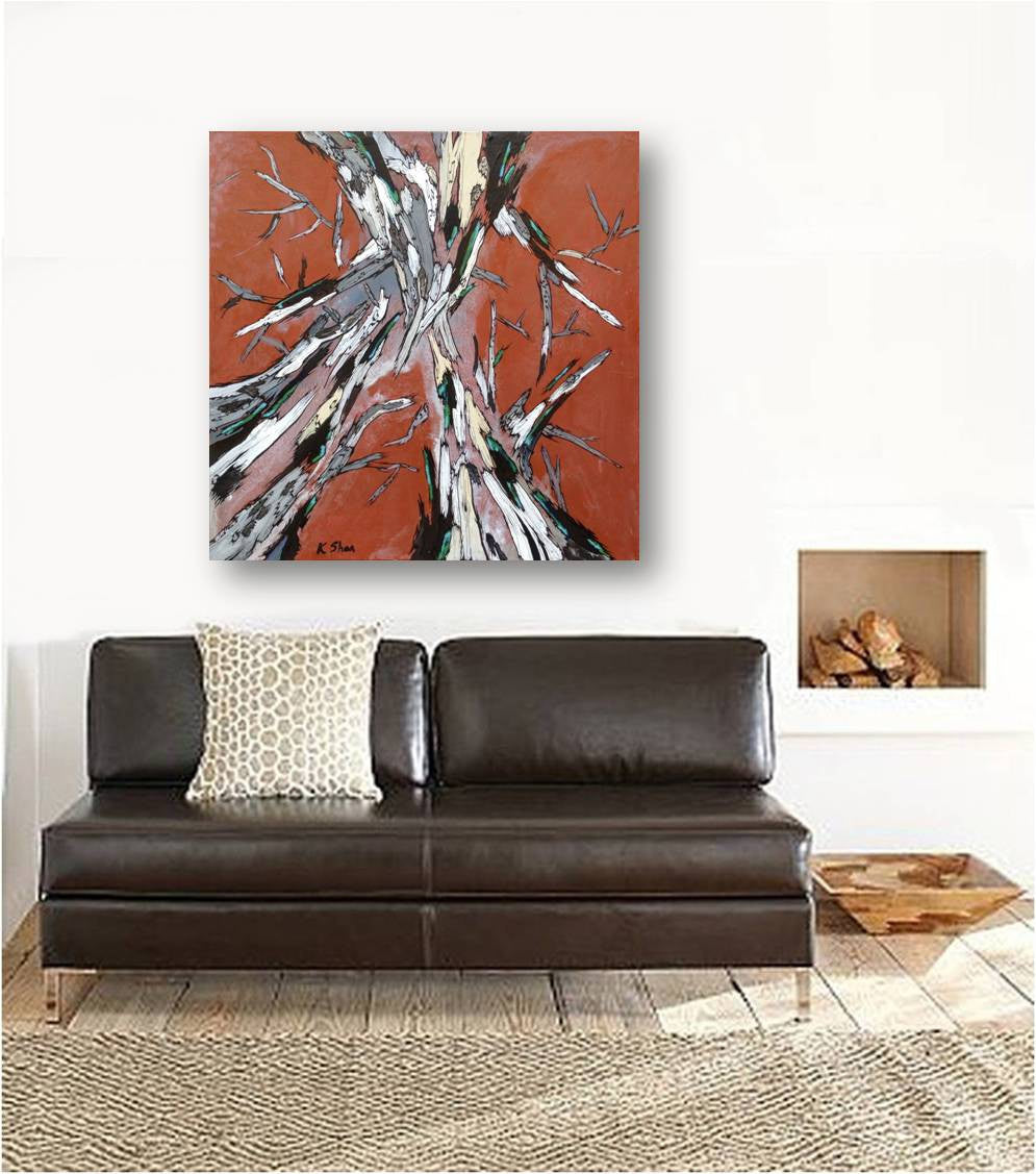 Burnt orange and white canvas wall art on white wall of rustic space over brown leather loveseat