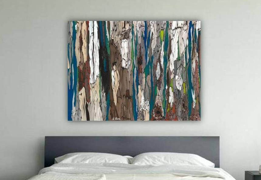 Oversized abstract canvas art print of dense trees in deep blues and colorful accents, in a large bedroom