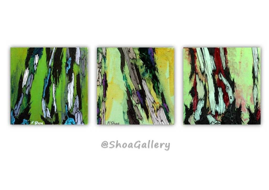 Set of 3 small square paintings of abstract tree trunks. Gallery display of shades of green