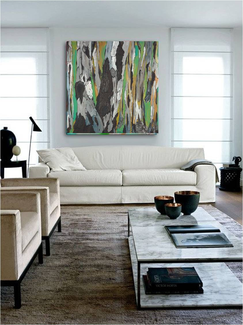 A large canvas wall art featuring a green, gray, white abstract tree landscape, above a modern living room setup.