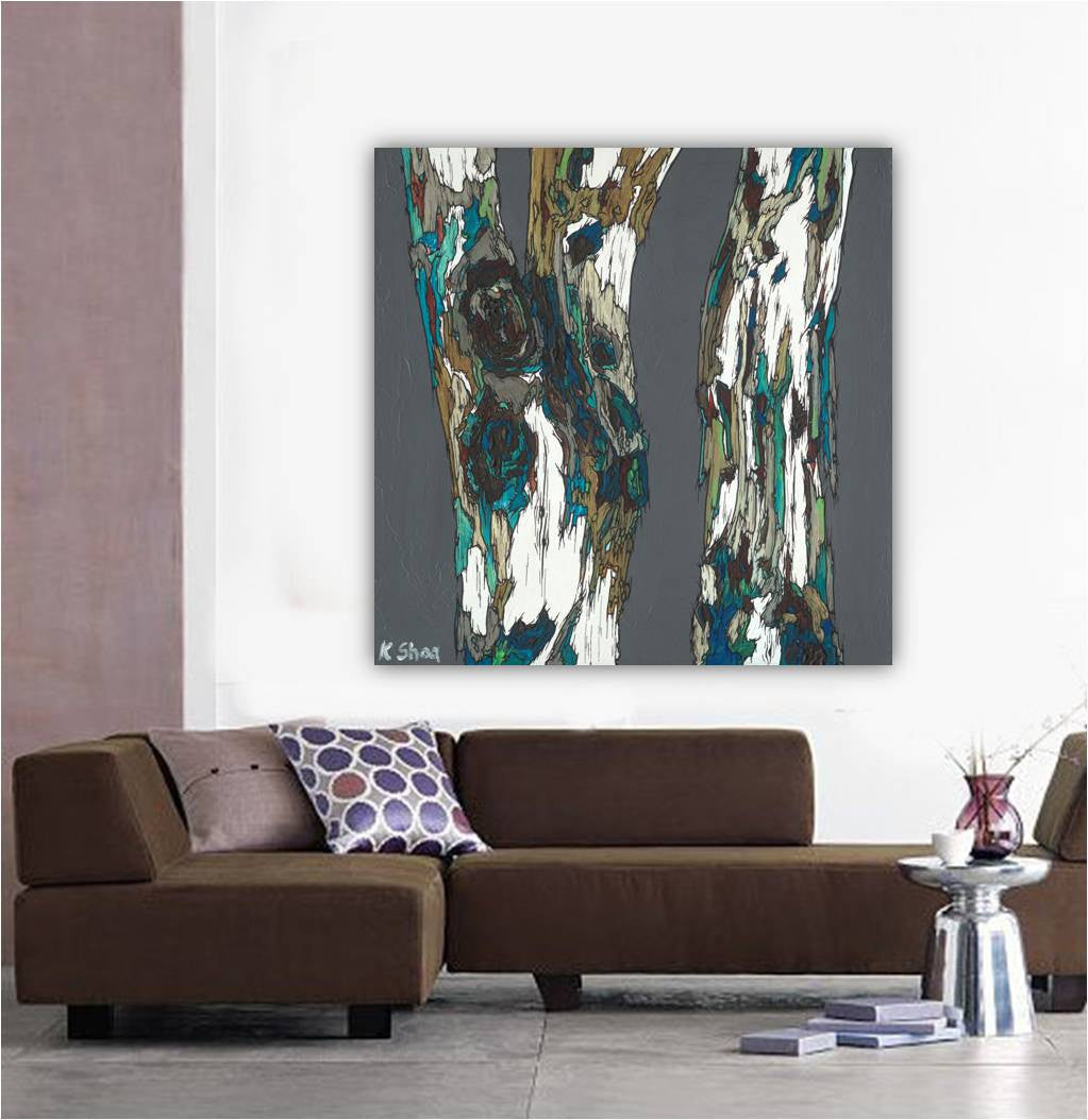 Large square canvas art print of bold tree design in a MCM mid-century modern contemporary living room w/ a sectional sofa