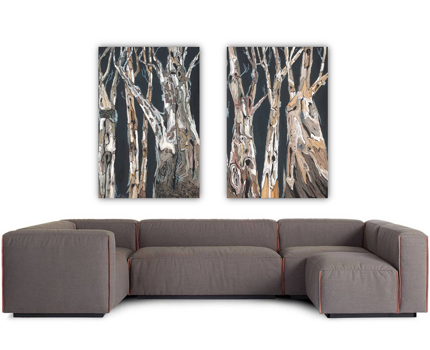 Very large set of 2 tree art over a dark gray sofa in a modern setting.